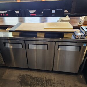 Everett commercial dishwasher being serviced by professional appliance technician