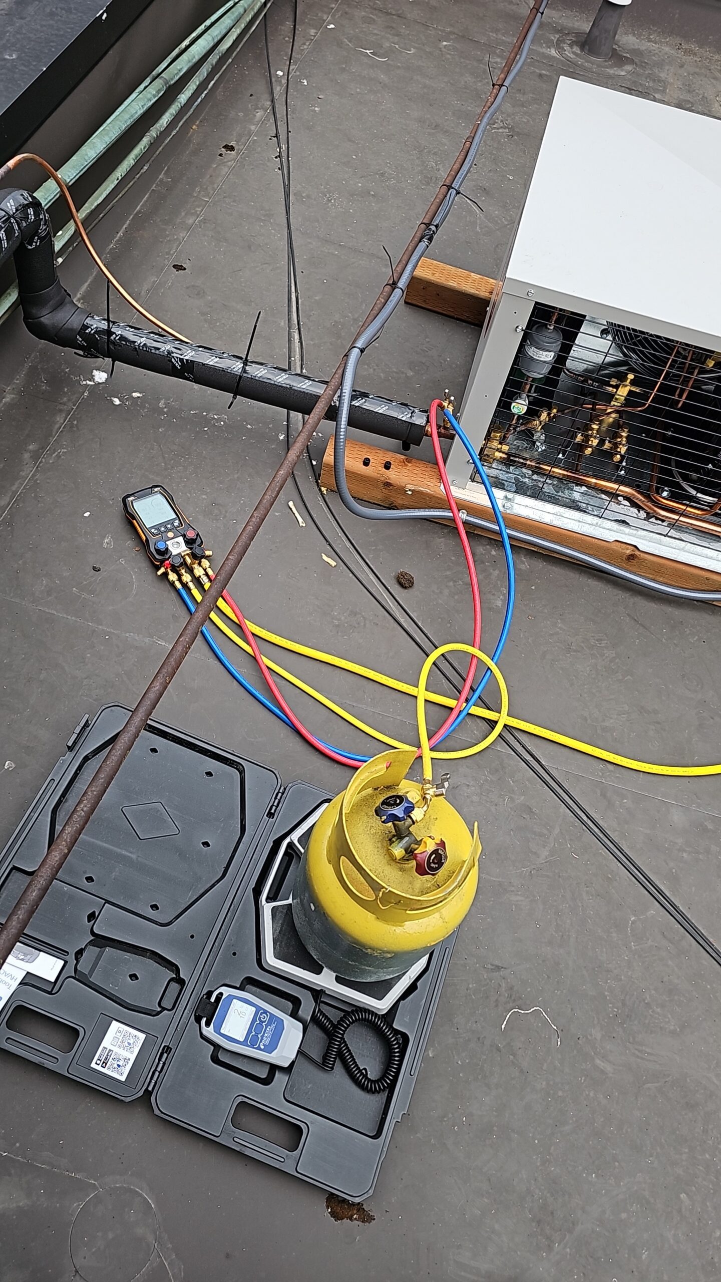 commercial appliance repair technician is using measuring tools while working on a repairs project in Seattle