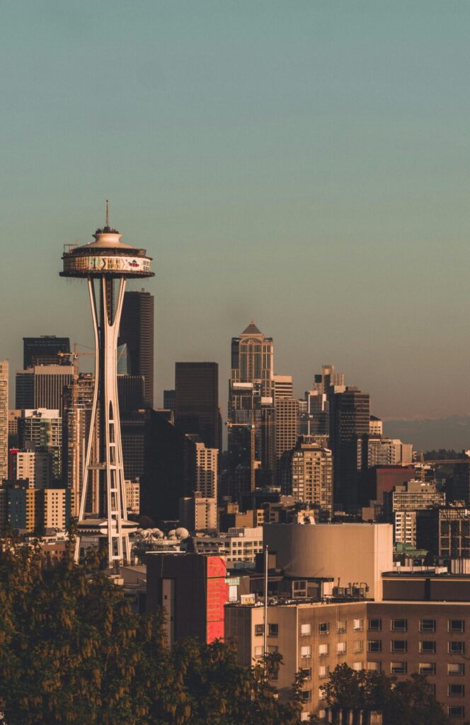 Stunning view of Seattle's skyline featuring the Space Needle with Mount Rainier in the background.