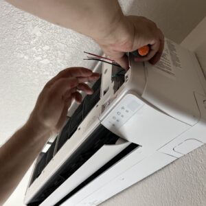 An everett homeowners are getting air conditioning services. Checking mini split system wires