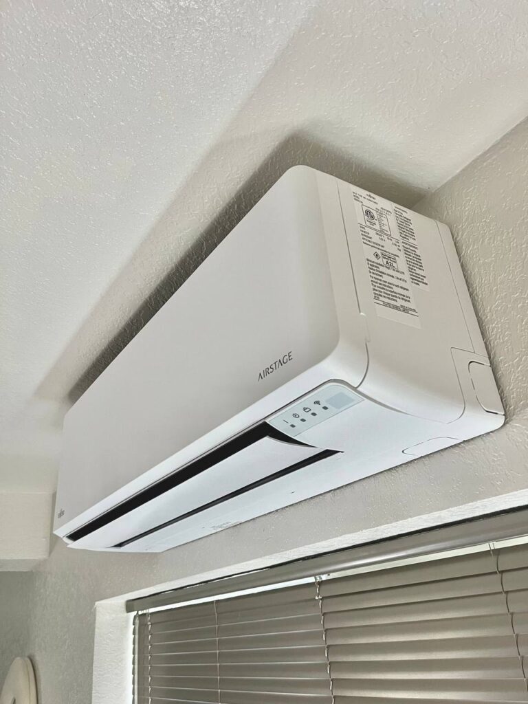 Certified a high-efficiency SEER2 compliant mini split system unit. White color