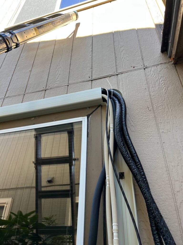 Professional HVAC technician in Seattle preparing a nitrogen purge and triple evacuation for a ductless heat pump install.