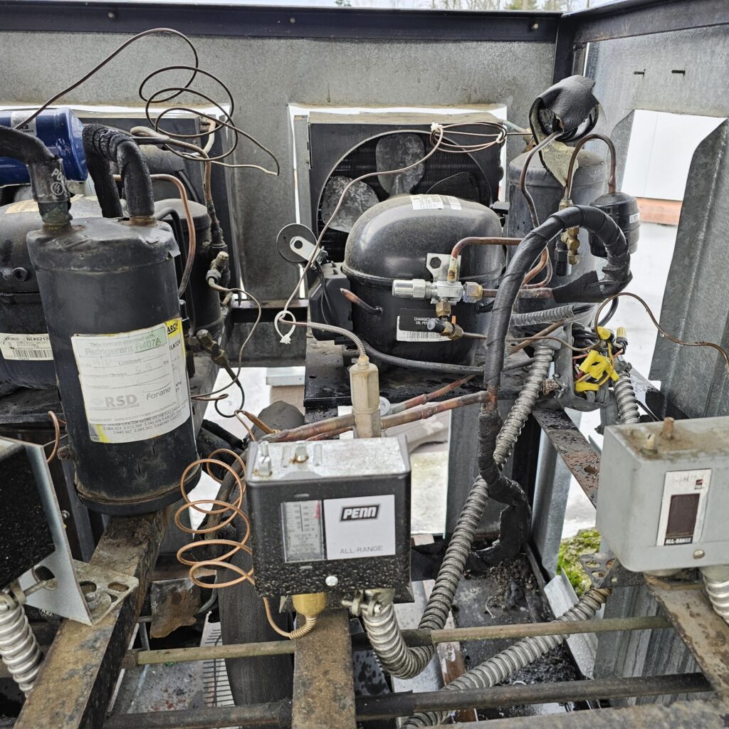 refrigeration service and repair process for a project in seattle, You can see Compressor, Condenser Coils, Evaporator Coils, Blower Motor and Fan (Moves air through the ductwork), Economizer, Expansion Valve, Heat Exchanger, Air Filters, Contactors and Capacitors, Condensate Drain Pan 