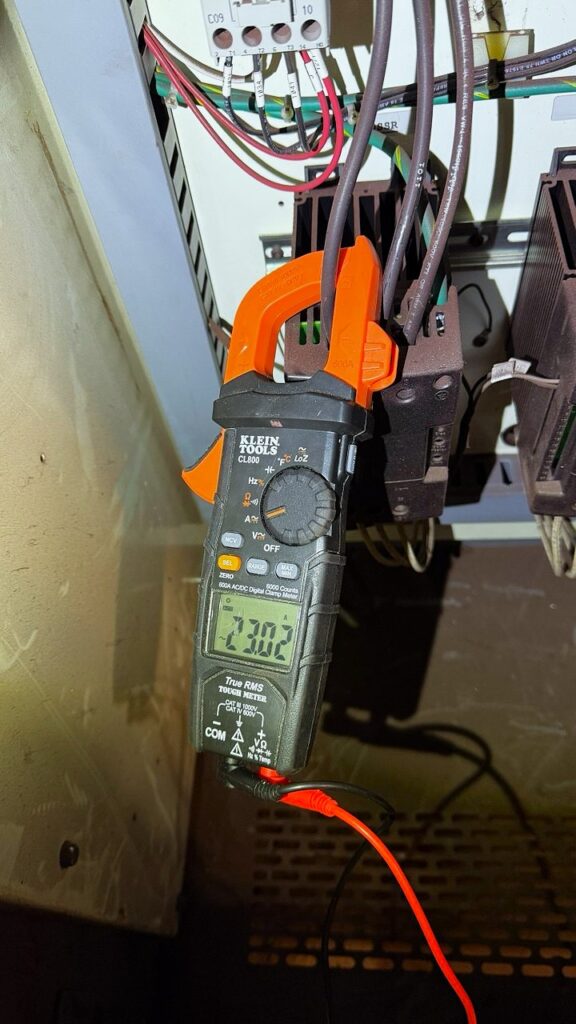 Commercial Steam Oven Diagnostic Prior to Repair in Seattle. Digital multimeter is used to test electricity flow