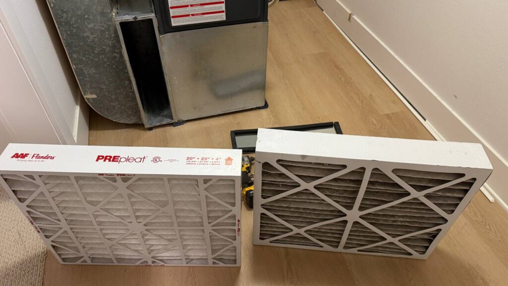 High efficiency 96% gas furnace maintenance and diagnostics. Old dirty filter replacement.