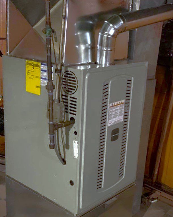 Side profile of a compact gas furnace system showing clean ductwork and gas line connections.