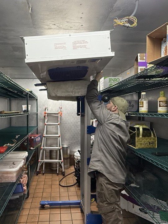 walk in cooler repair techincian during process of Evaporator Coil Replacemet.