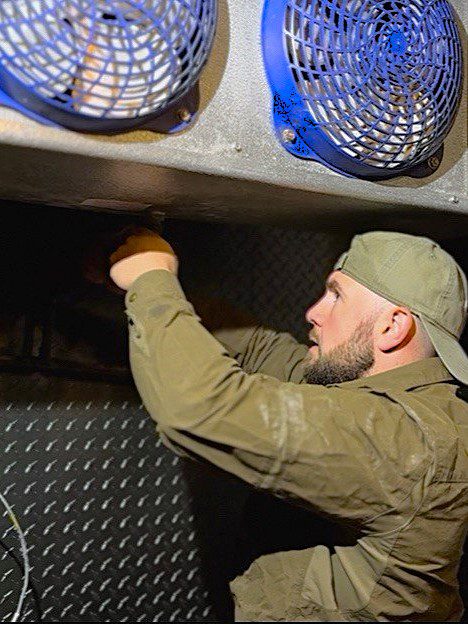 A/C Dr. Naz is repairing walk in cooler for commercial refrigerator repairs in Seattle's hotel restaurant on summer 2025, condensate pipe is getting checked