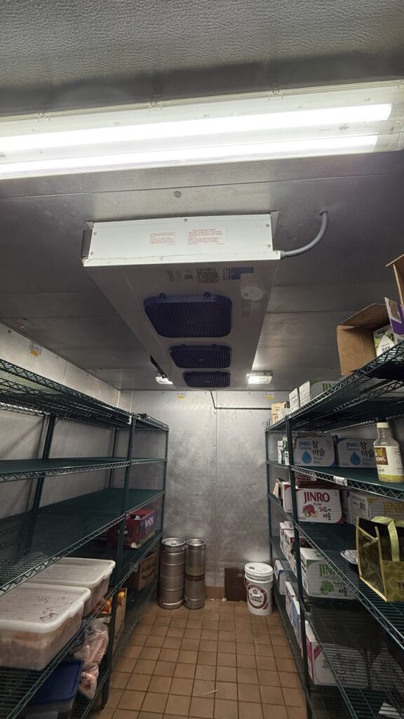Evaporator Coil is hanging on the ceiling of walk in cooler
