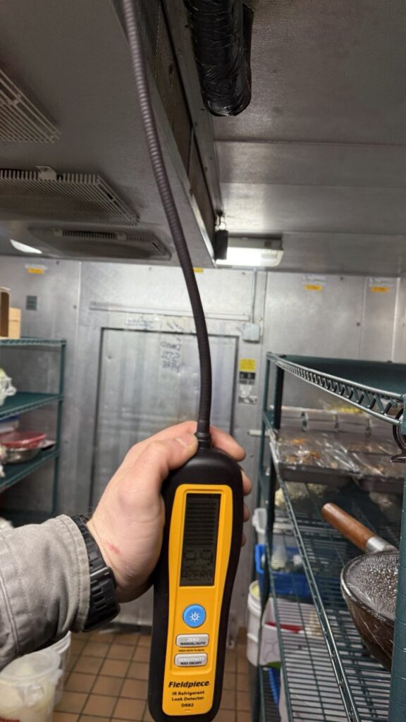 Refrigerant Gas Leak Repair process, technician is testing the refrigerator