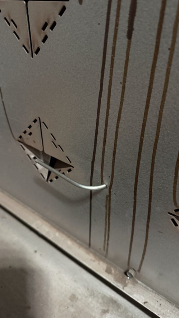 Checking the air-tight seal after a professional oven door gasket installation on a commercial unit in a Tacoma catering facility.