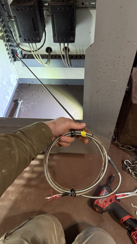 A technician organizing genuine OEM replacement parts for commercial ovens to ensure high-quality, long-lasting repairs for Seattle clients.