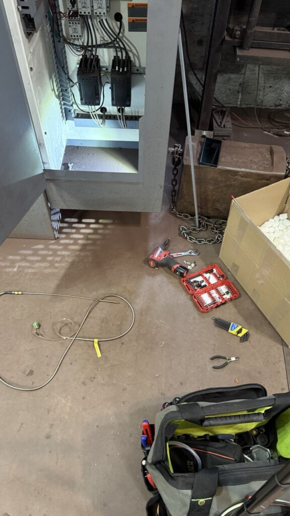 Close-up of a technician installing a new Blodgett convection oven heating element to restore consistent baking temperatures.