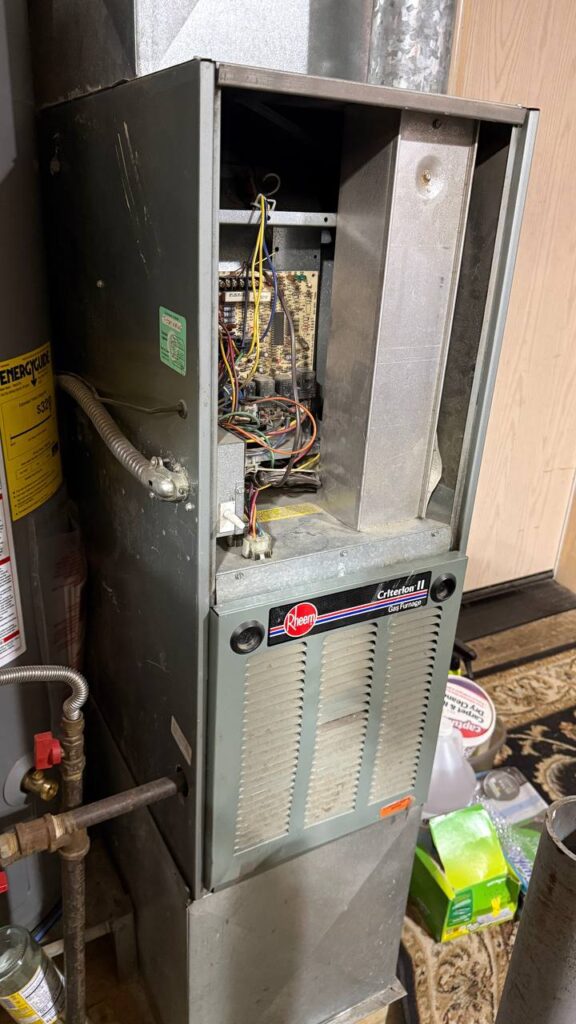 Licensed and EPA and HVAC/R Certified A/C Dr. Naz technician performing furnace diagnostic and heating repair in Marysville Washington