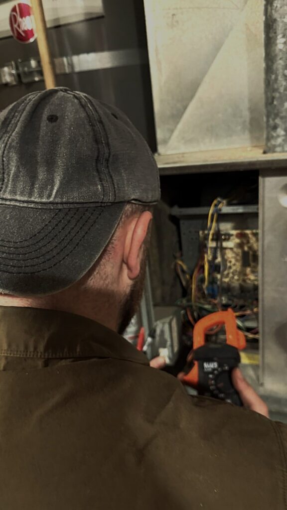 A/C Dr. Naz performing diagnostic on residential furnace in Marysville home