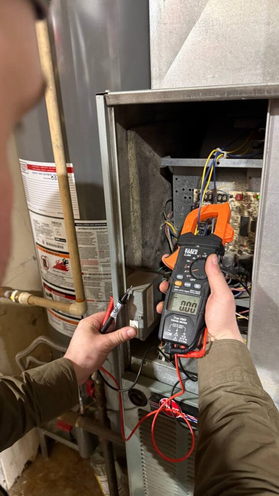 Old gas furnace before repair in Marysville home