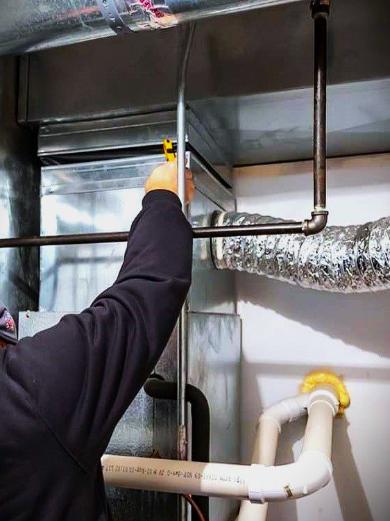 A technician from A/C Dr. Naz is working on Air duct cleaning services in seattle, wa