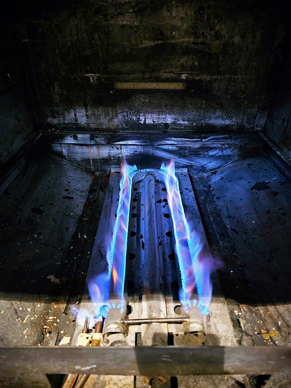 inside a commercial gas stove during the process of Commercial Gas Range Repair in Seattle, WA
