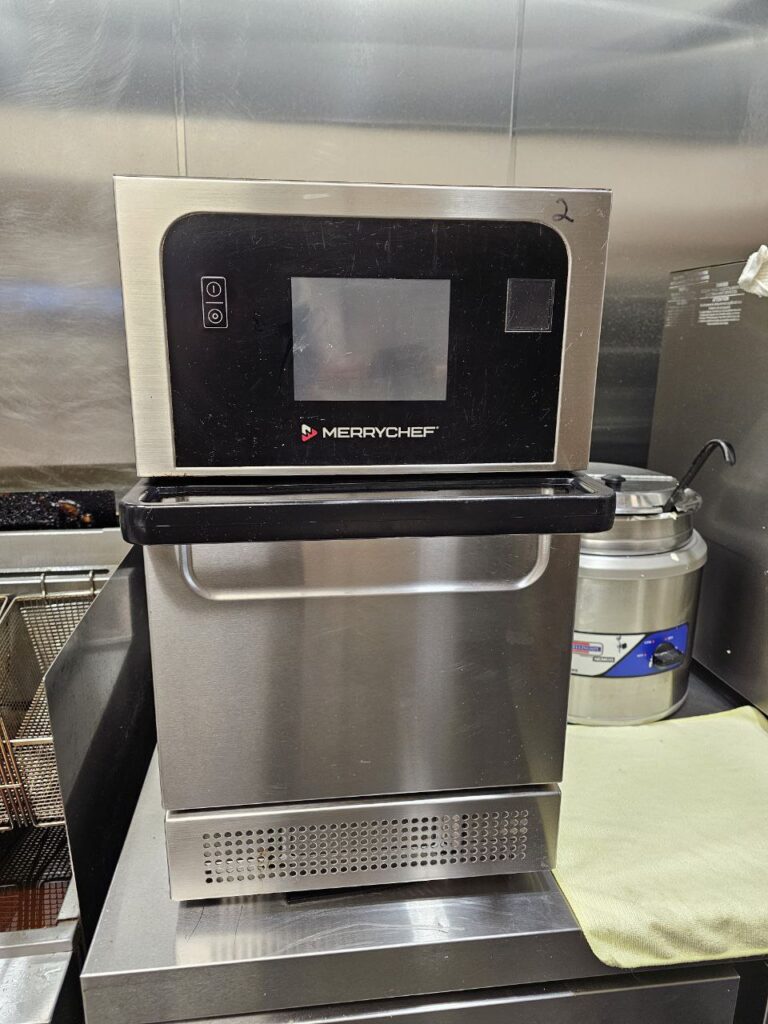 Commercial kitchen rapid-cook oven in Seattle, WA, positioned for inspection by A/C Dr. Naz technicians.
