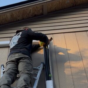 An A/C Dr. Naz technician in Snohomish County is using a calibrated torque wrench and a nitrogen purge setup to finalize the installation of a high-efficiency Daikin Aurora mini-split. We prioritize Manual J Load Calculations and a 500-micron triple evacuation to ensure a leak-free system.