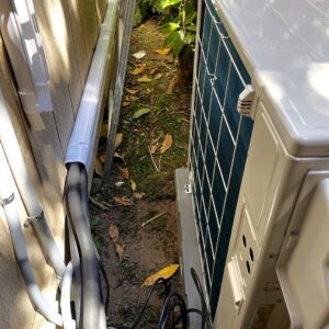 A visual visualization of the home comfort journey provided by A/C Dr. Naz in the North Sound. The panoramic image shows a seamless transition from a misty Seattle morning to a perfectly controlled interior, highlighting our specialized Daikin Aurora and Mitsubishi Hyper-Heat baseboard-to-ductless conversion solutions.