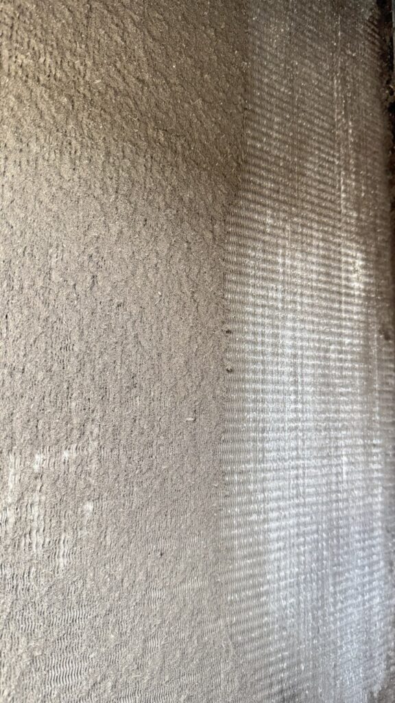 Comparison of dirty used air filters next to new Parker pleated filters during a commercial HVAC maintenance visit.