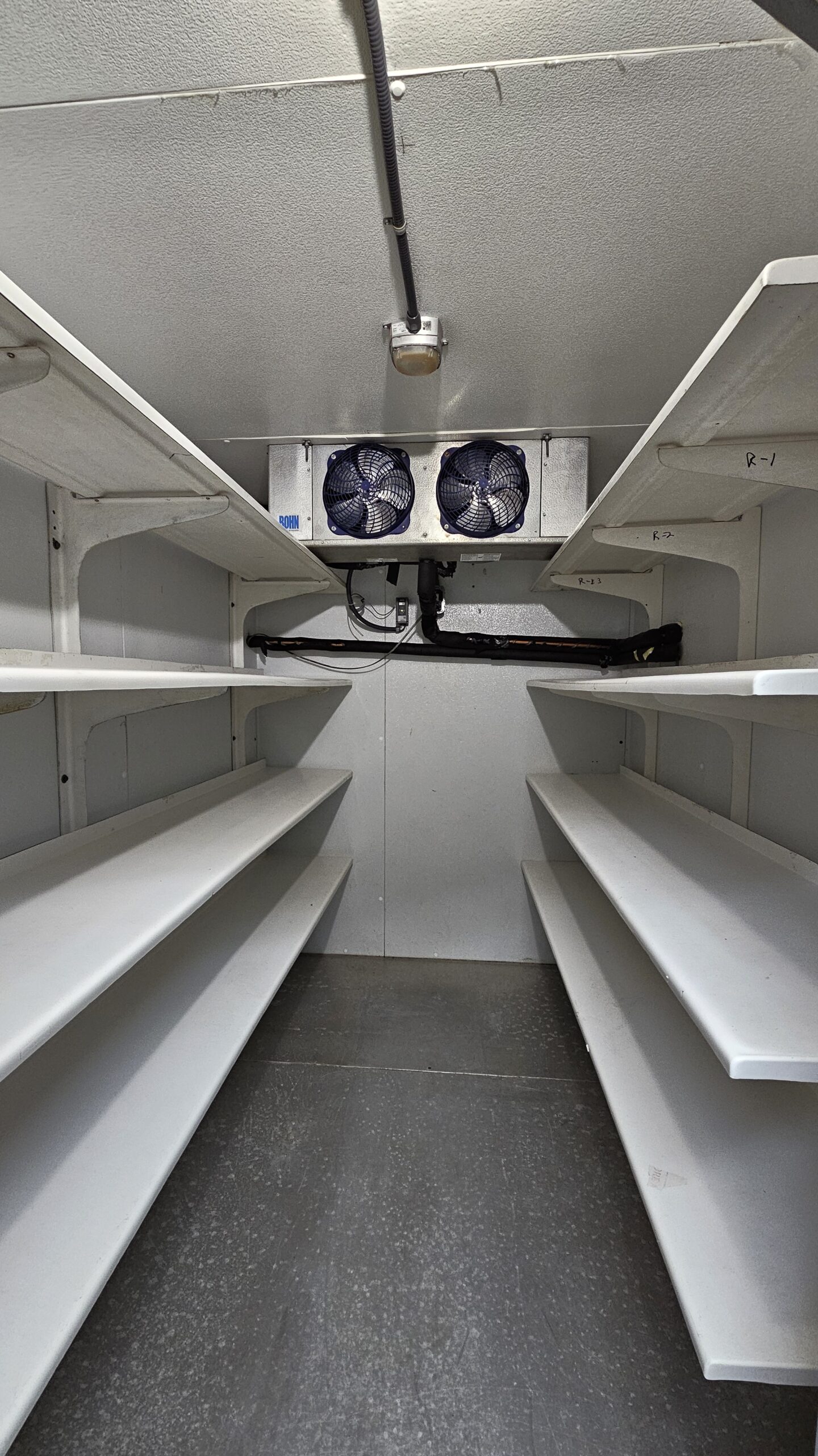 Professionally repaired walk-in cooler unit in Marysville, WA, featuring a newly installed OEM start capacitor and clean condenser coils. The system has been restored to peak efficiency for a commercial facility in zip code 98271 following an expert refrigeration diagnostic.