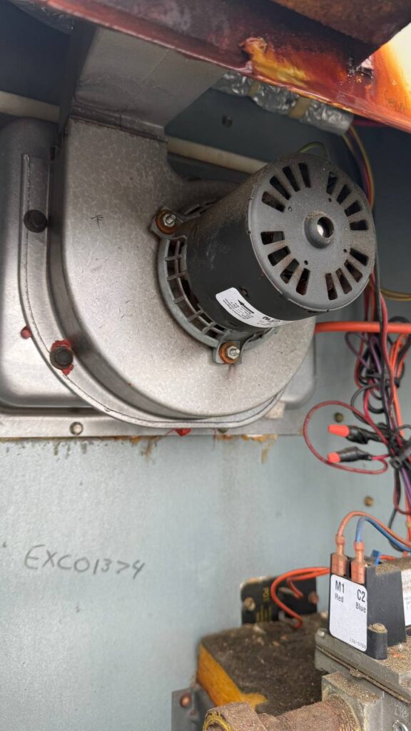 Close-up of commercial AC contactor and wiring inside RTU during repair service