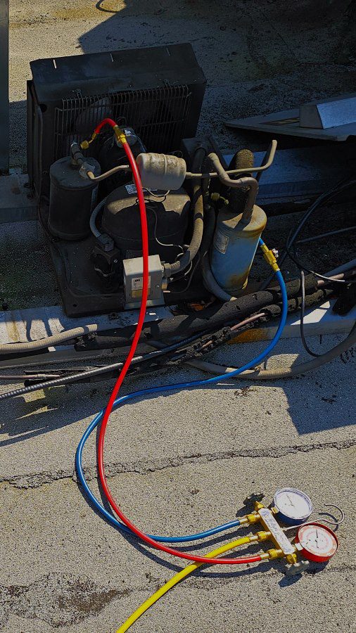 Fixing a compressor failure on roof for walk in cooler repair in bellevue, wa