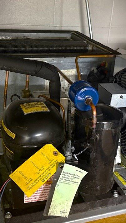 Fixing a compressor in walk in cooler for repair in bellevue, wa