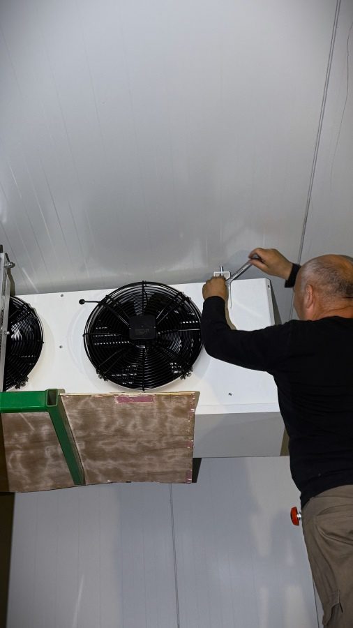 HVACR certified technician performing precision walk-in cooler repair at a Woodinville winery, focusing on engineering-first diagnostics for commercial refrigeration systems.