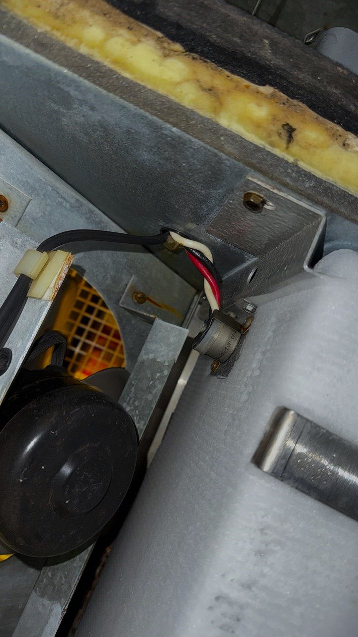 A/C Dr. Naz technician inspecting frozen refrigeration components during a same-day walk-in cooler recovery in Everett, WA.