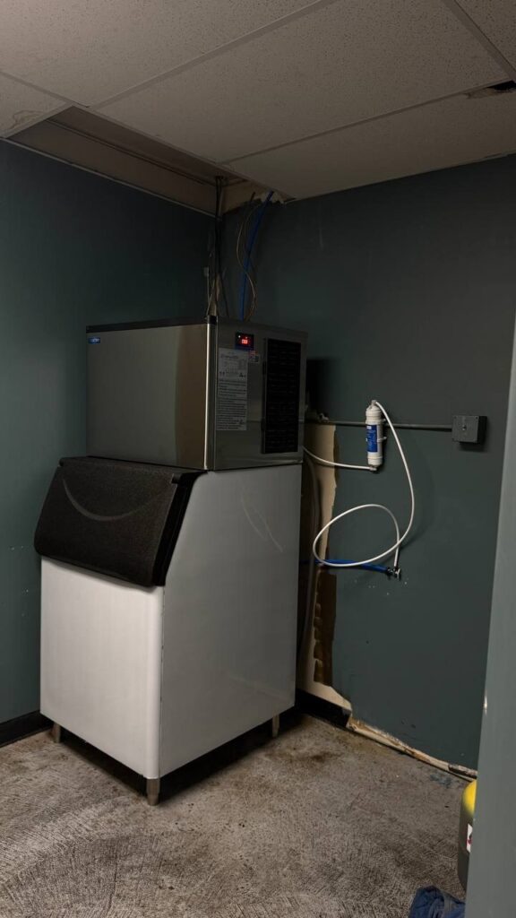 Commercial ice machine bin with soft ice at Marysville gas station before repair