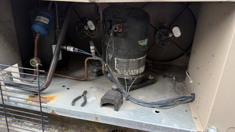 Commercial HVAC compressor diagnostics on rooftop equipment.