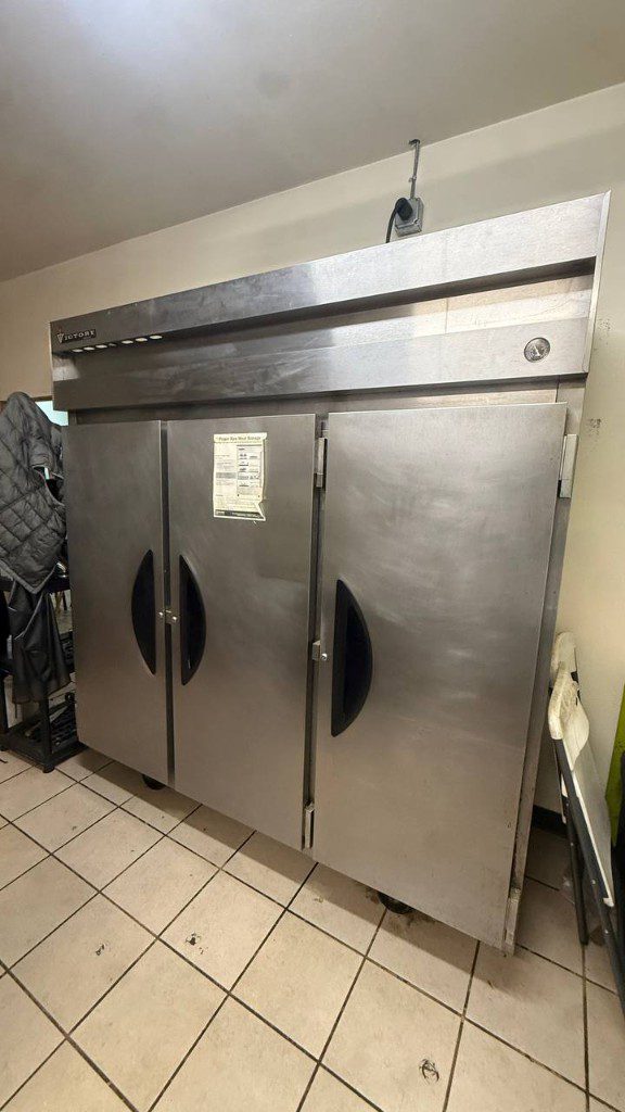 Field photo of a Victory three-door commercial reach-in refrigerator — serves Newcastle, WA commercial refrigeration repair