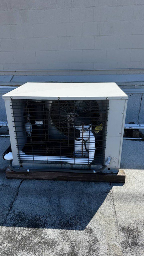 Field photo of rooftop commercial condensing unit on a flat roof — serves Sultan, WA commercial refrigeration repair
