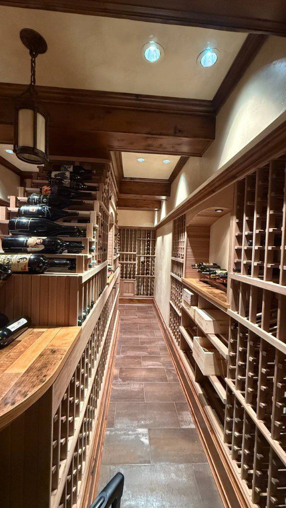 Field photo of completed custom wood wine cellar with climate-controlled storage — serves Issaquah, WA commercial refrigeration repair