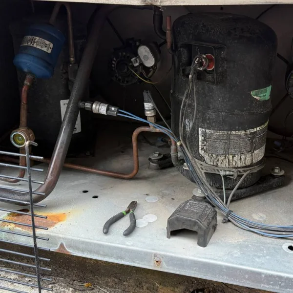Commercial HVAC compressor diagnostics on rooftop equipment.