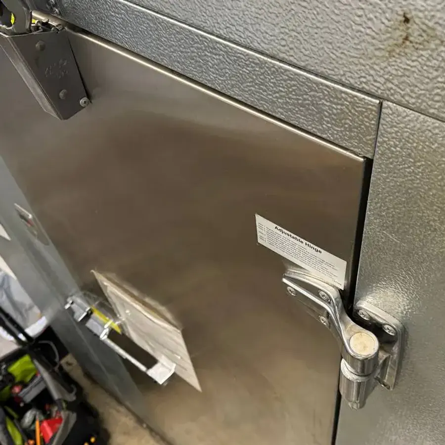 A/C Dr. Naz diagnosing a commercial walk-in freezer