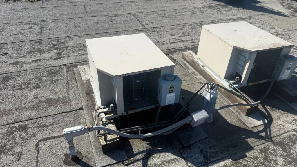Walk-in cooler condensing units on a commercial roof