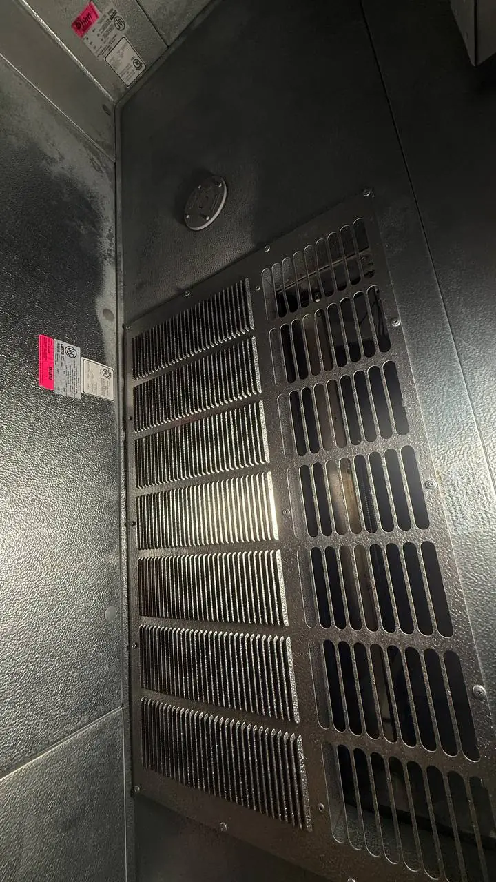 A/C Dr. Naz technician verifying gauges and sequence on a low-temp freezer