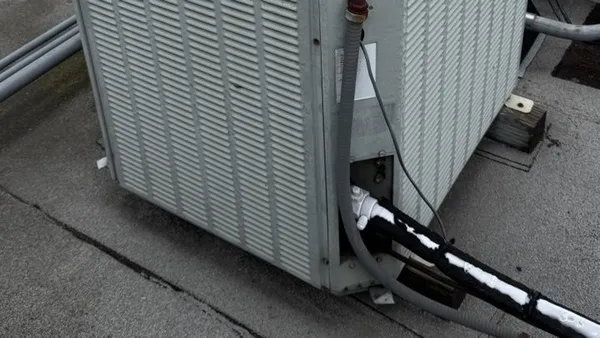 Refrigerant lines and conduit at a rooftop unit